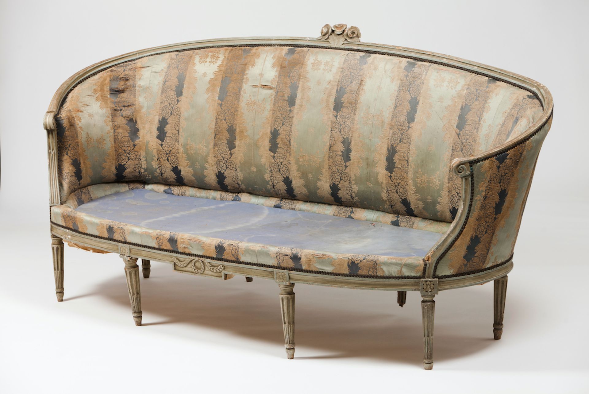 A Louis XVI setteeCarved and painted woodTextile upholsteryFrance, 18th century(losses, faults and