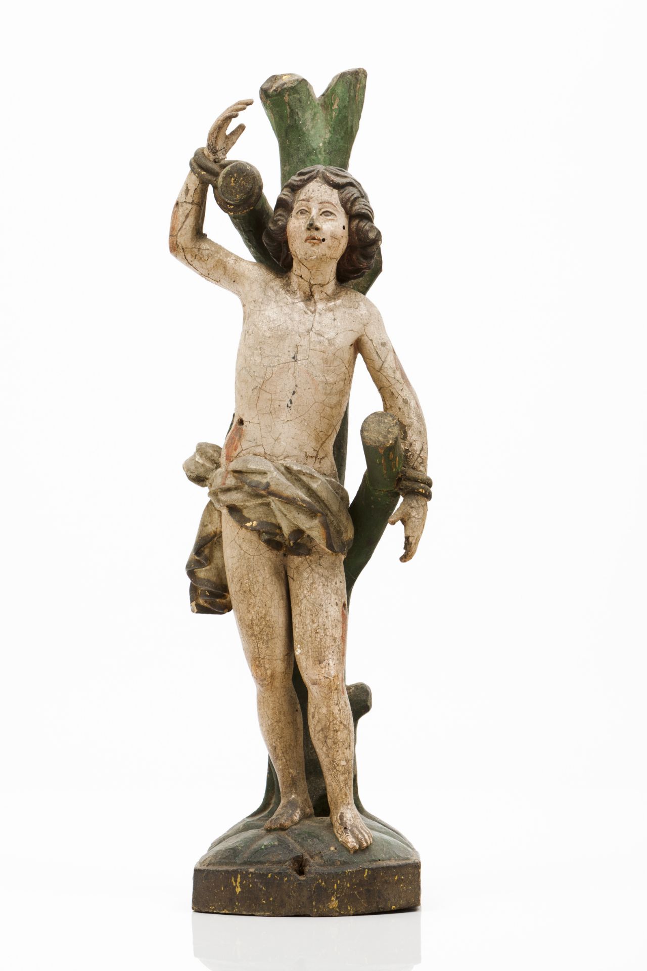 A Saint SebastianCarved and polychrome wooden sculpturePortugal, 18th century(losses and faults)