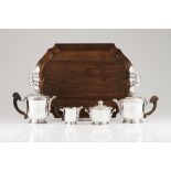 A tea and coffee set with trayFrench silverIn the Baroque style with volute exotic wood handles