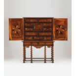 Cabinet on standWalnutThorn bush and ebony inlaid decorationOf two doorsEleven inner drawers and a
