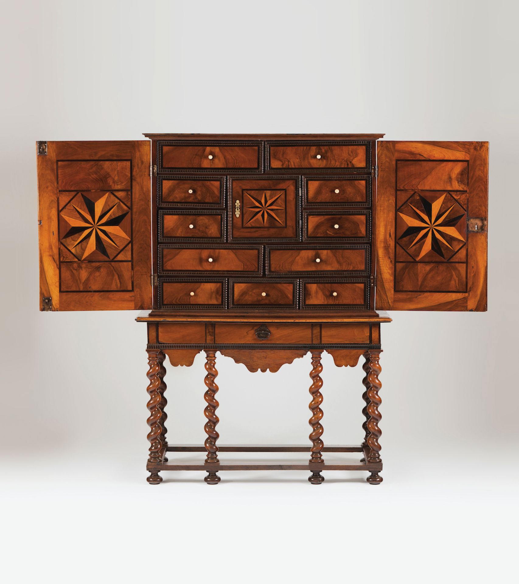 Cabinet on standWalnutThorn bush and ebony inlaid decorationOf two doorsEleven inner drawers and a