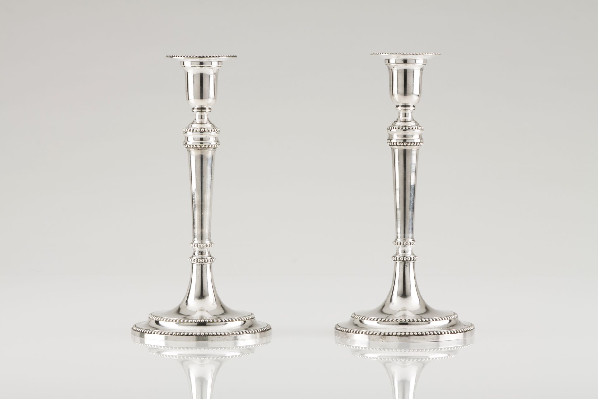 A pair of D. Maria candlesticksPortuguese silver, 18th /19th centuryPlain turned shaft of beaded