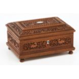 An Anglo-Indian boxCamphor woodProfusely carved decoration of floral motifs and animalsSilvered