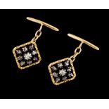 A pair of cufflinksGoldSquare shaped of black enamel background set with star of antique brilliant