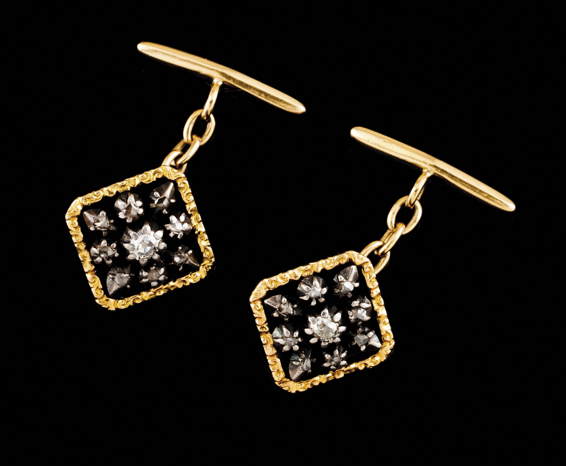 A pair of cufflinksGoldSquare shaped of black enamel background set with star of antique brilliant