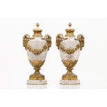 A pair of Louis XV style urnsPink marble of gilt and chiselled bronze mounts with garlands,