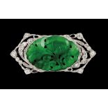 A broochPlatinumLace decoration set with small brilliant cut diamonds and foliage motifs carved and