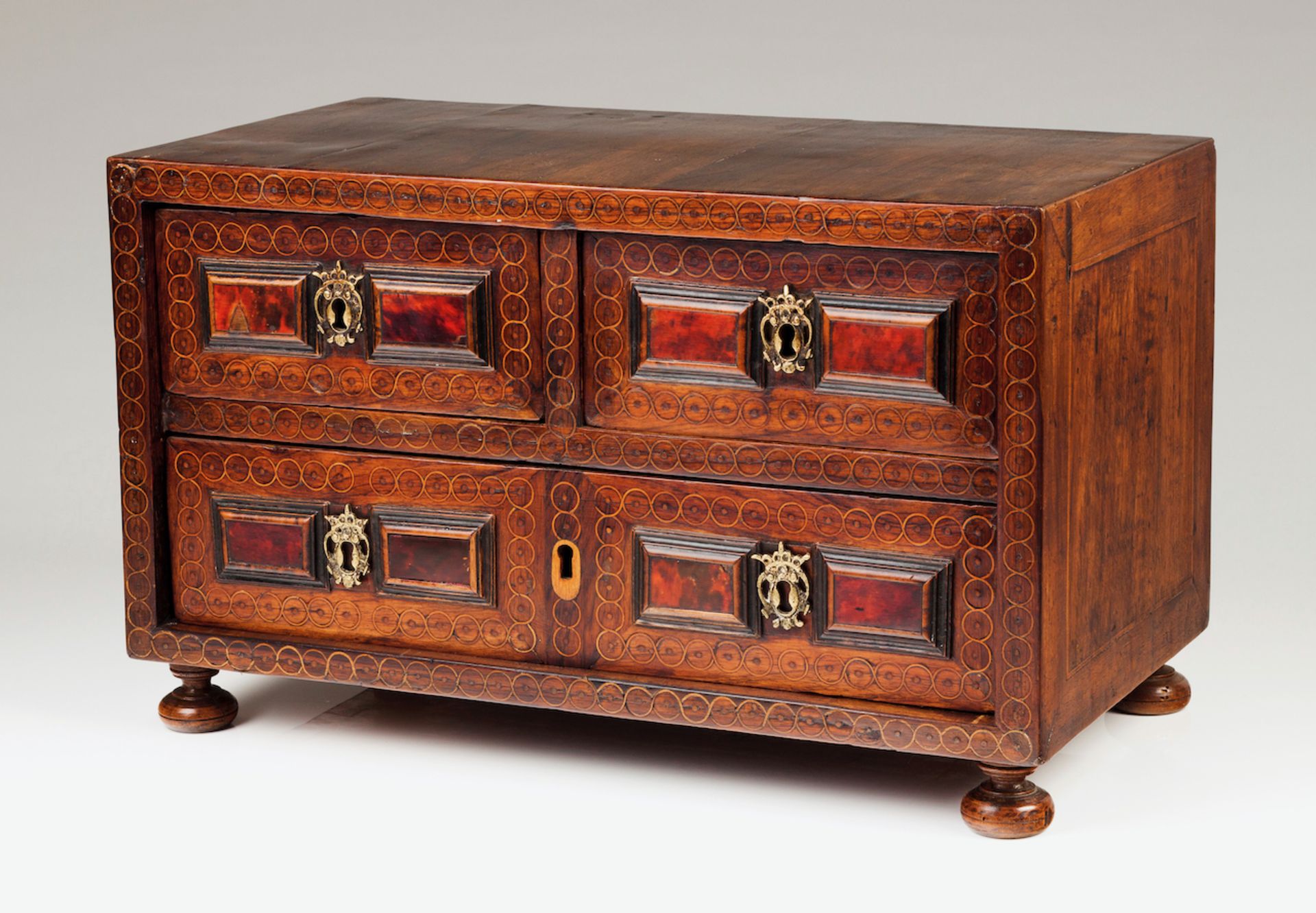 A small Mannerist cabinetSolid and veneered walnut of brass inlaid decorationTortoiseshell coated
