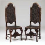 A pair of tall back chairsRosewoodEngraved leather backs and seats fixed by yellow metal large