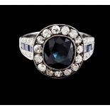 A ringGold 750/1000 and silver 925/1000Set with one sapphire (ca.2.80ct) framed by 15 antique