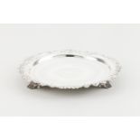 A salverPortuguese silver, 19th centuryChiselled base of circular motifsScalloped lip of raised
