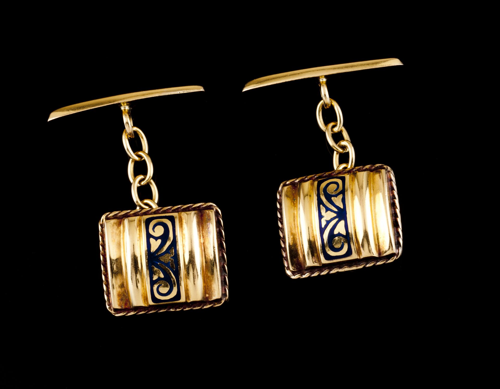 A pair of cufflinksPortuguese goldRectangular shaped of raised blue enamelled band with