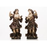 A pair of seraph angelsCarved and brown painted woodPortugal, 18th/19th century(losses and faults,