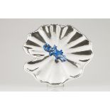 A centrepiecePortuguese silverA large water lily leaf with applied blue and white hardstone sculpted
