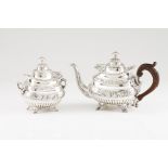 A mid-19th century Portuguese silver tea pot and sugar bowlRaised on claw feet, fluted and relief