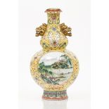 A gourdChinese porcelainPolychrome "Famille Rose" enamelled decoration of floral motifs on a