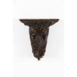 A bracketCarved chestnut of acanthus leaved and angel head decorationEurope, 19th century(losses,