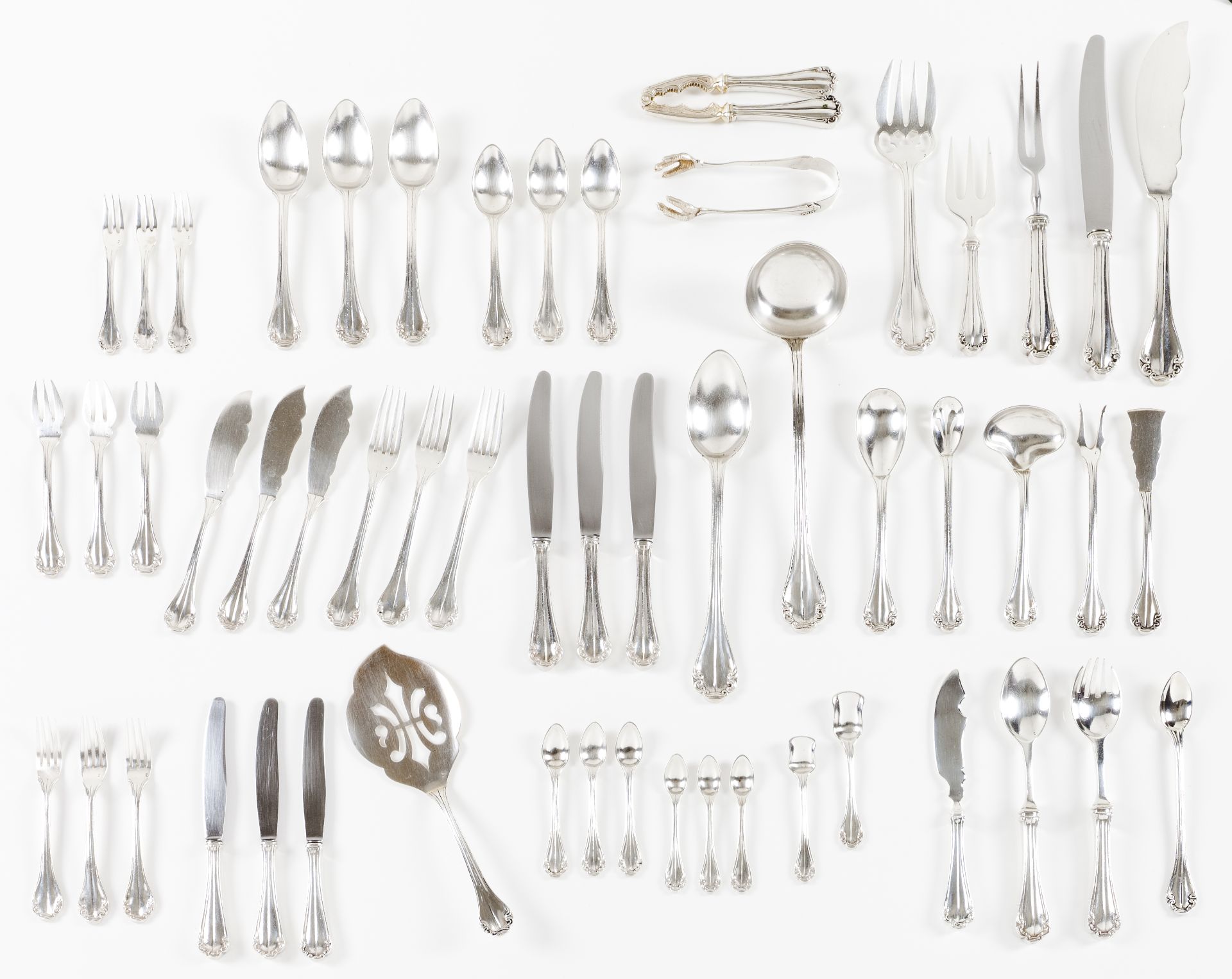 A 12 cover cutlery setPortuguese silverFrieze and volute decorated handlesSoup spoons, meat forks