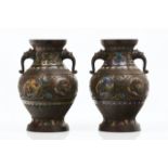 A pair of vasesPatinated bronzeRaised geometric decoration with polychrome floral motifs cloisonne