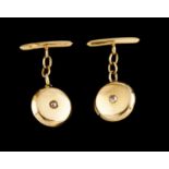 A pair of cufflinksPortuguese goldPlain circular shaped, set with two crowned rose cut