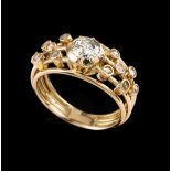 A ringGoldSet with one brilliant cut diamond (ca.0.42ct) possibly colour J/K SI3 , and 12 rose cut