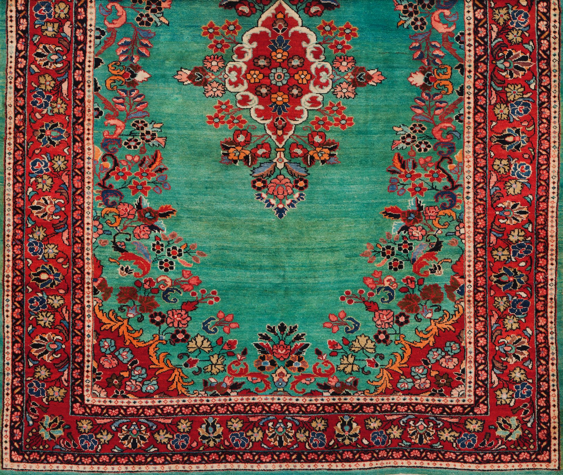 A Sarouk rug, IranWool and cotton of floral design in bordeaux, beige and turquoise blue300x210 cm