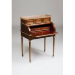 A Louis XVI roll top deskMahogany of inlaid gilt metal decorationUpper section with three drawers