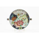 A warming plateChinese export porcelainPolychrome "Famille Rose" enamelled porcelainQianlong