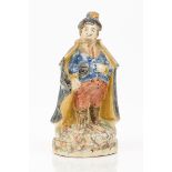 A bottleFaience depicting male figure with cloakPolychrome decorationPortugal, 19th