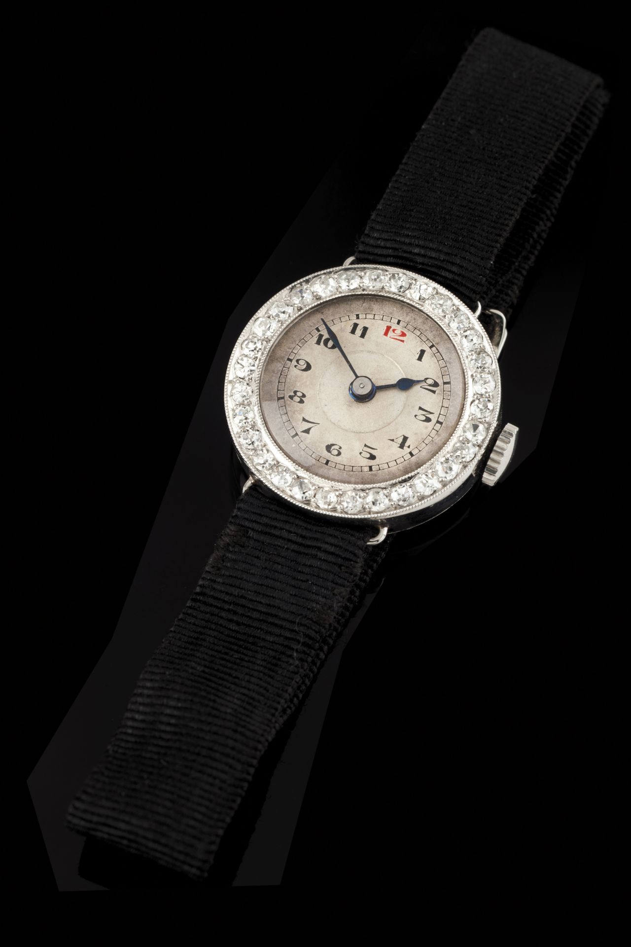 A lady's wrist watchPlatinum 950/1000Circular case of white face and Arabic numerals with bevel