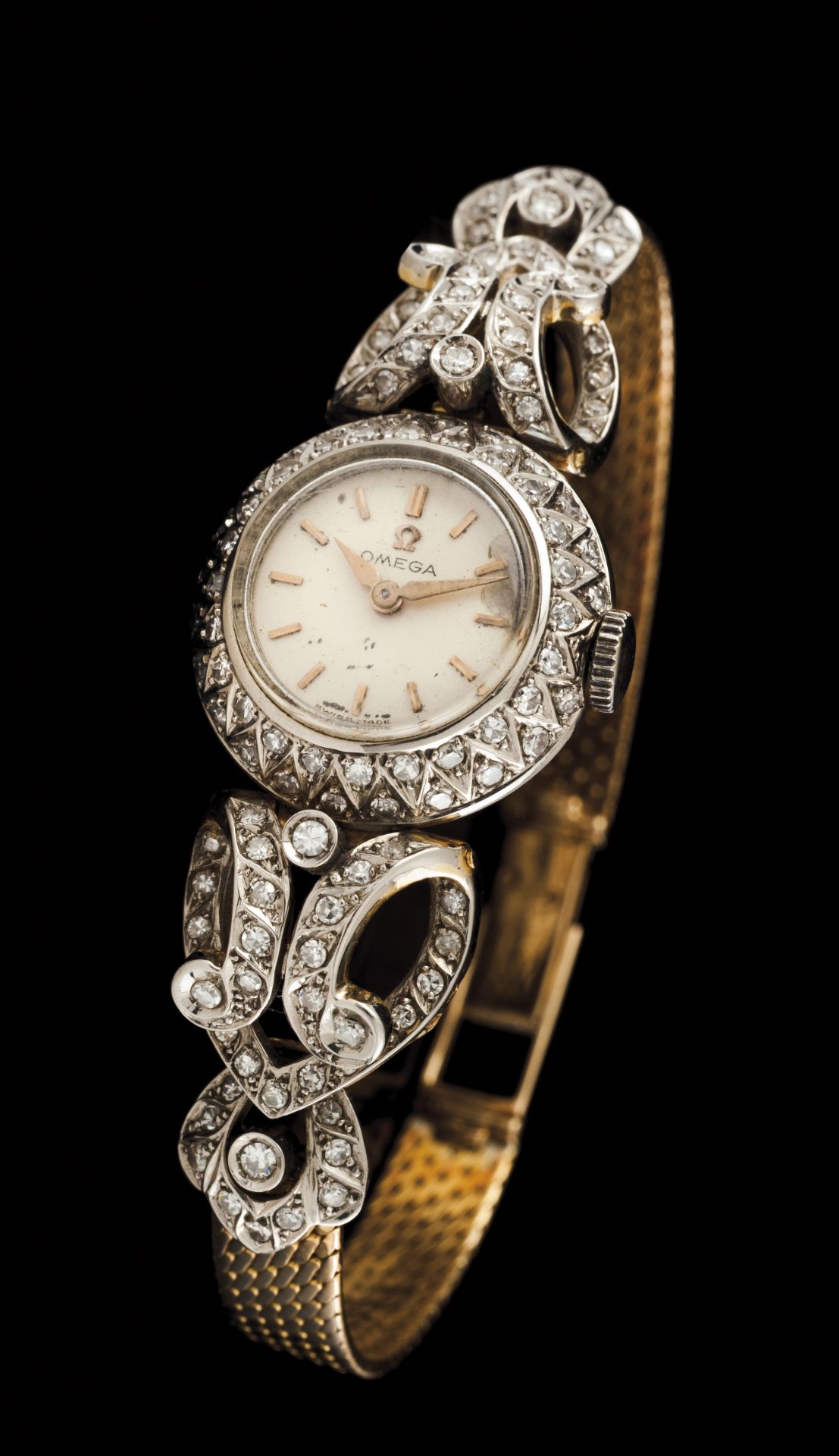 An OmegaBicoloured goldLady's wrist watch of case and part of strap set with 8/8 cut diamondsWorking