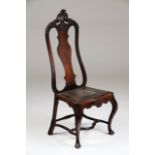 A D.José chairRosewoodCarved decorationScalloped and carved crestLeather seatPortugal, 18th century