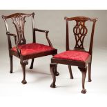 Two D. José style chairsOne armchairEbonized woodDecorated with carvingsRed silk upholstery