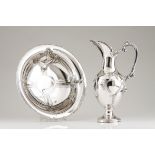 A basin and ewerPortuguese silverRaised and engraved decoration of floral and foliage motifs, shells