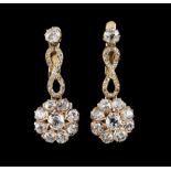 A pair of drop earringsGoldArticulated flower, drops set with 20 antique brilliant cut diamonds