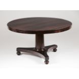 A breakfast tableRosewood and burr rosewoodTilt top of central pedestalEngland, 19th century77x140