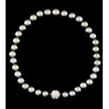 A pearl necklaceSouthern Seas pearlsLight grey tone in decreasing side from 14,5mm to 11mm with