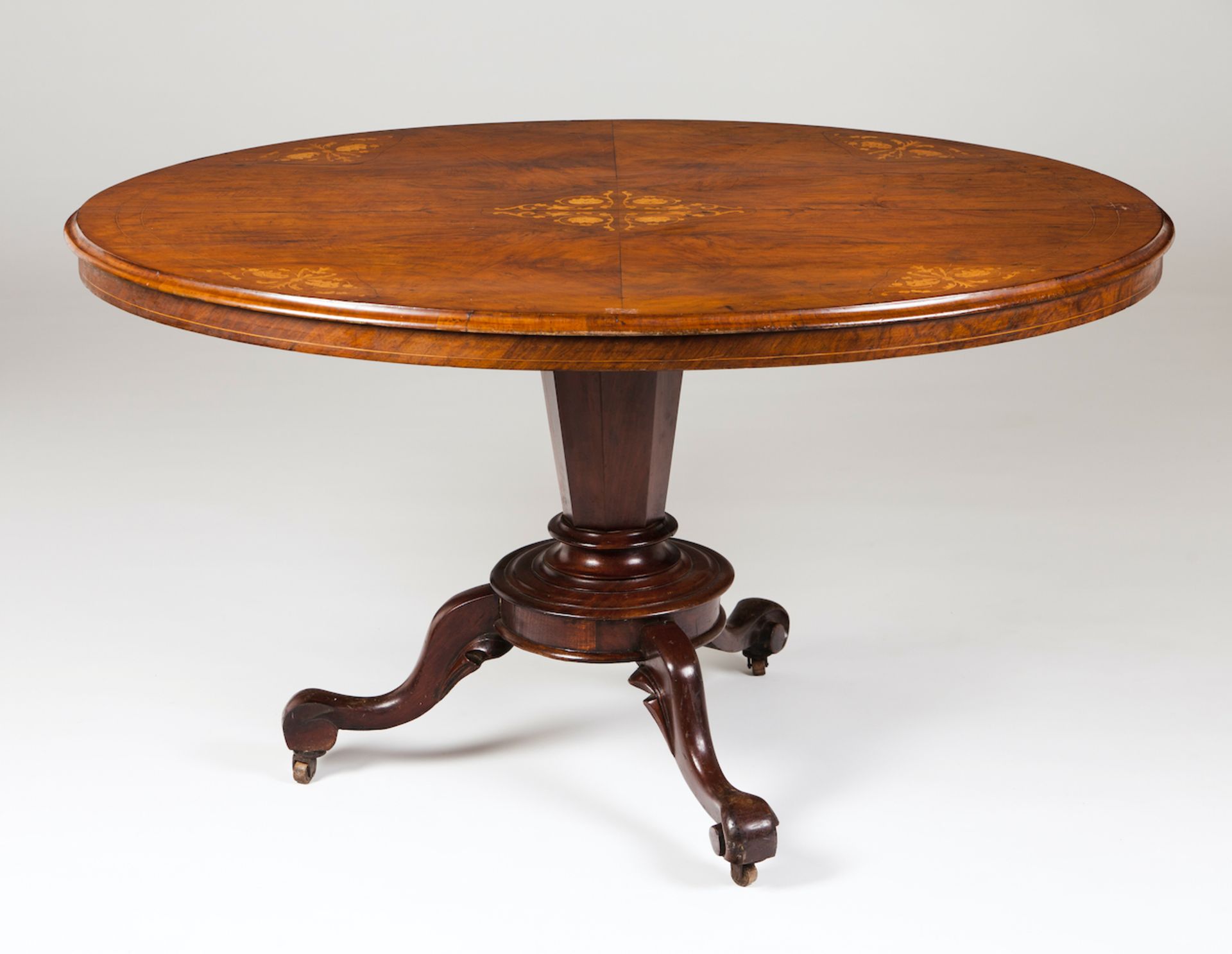 A Victorian breakfast tableSolid walnut and burr walnut veneered with thorn bush marquetryOval