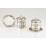 A two biscuit barrel and tray setPortuguese silverCylindrical body of profuse engraved decoration of