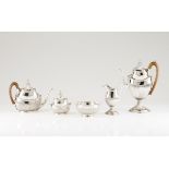 A D.Maria tea and coffee setPortuguese silver, 19th centuryFluted baluster shaped body of exotic