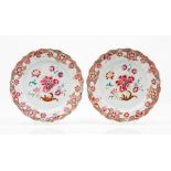 A pair of large scalloped plates