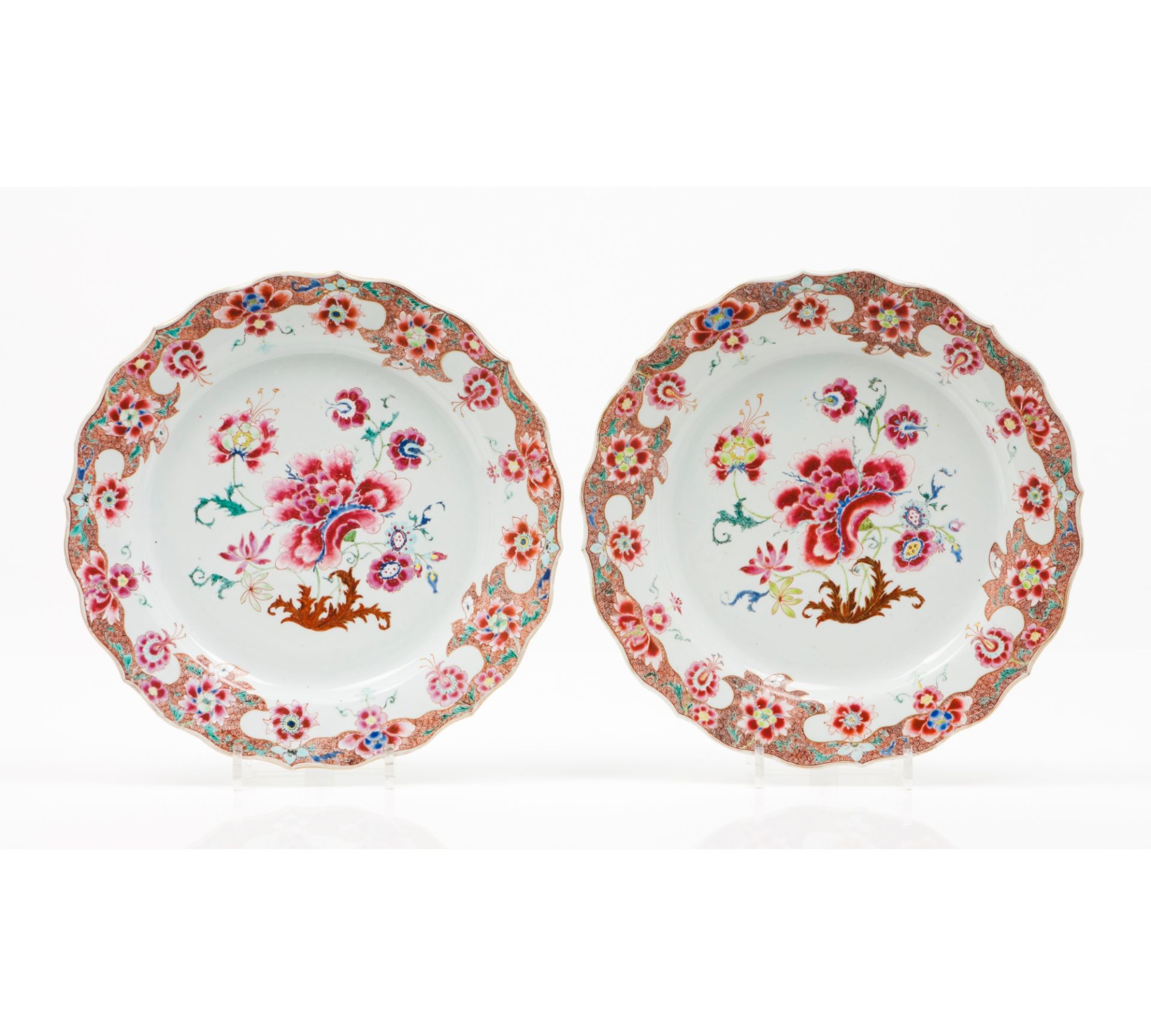 A pair of large scalloped plates