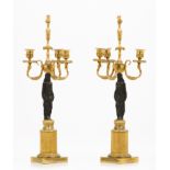 A pair of Empire three branch candelabra