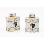 A pair of armorial tea caddies