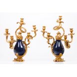 A pair of Louis XV five branch candelabra