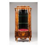 A Louis XVI style display cabinet