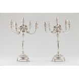 A pair of five branch candelabra