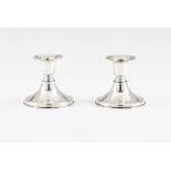 A pair of piano candlesticks