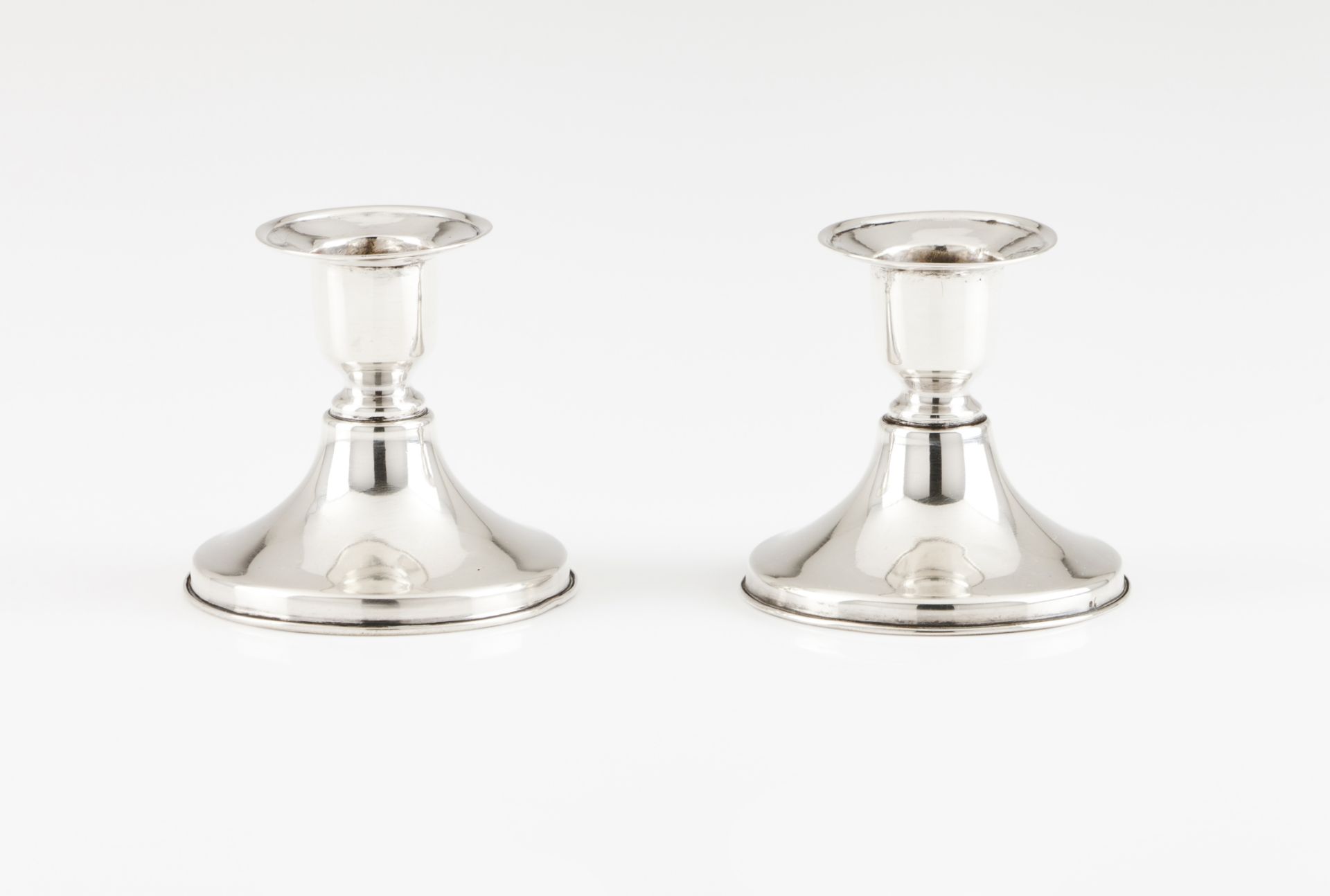 A pair of piano candlesticks