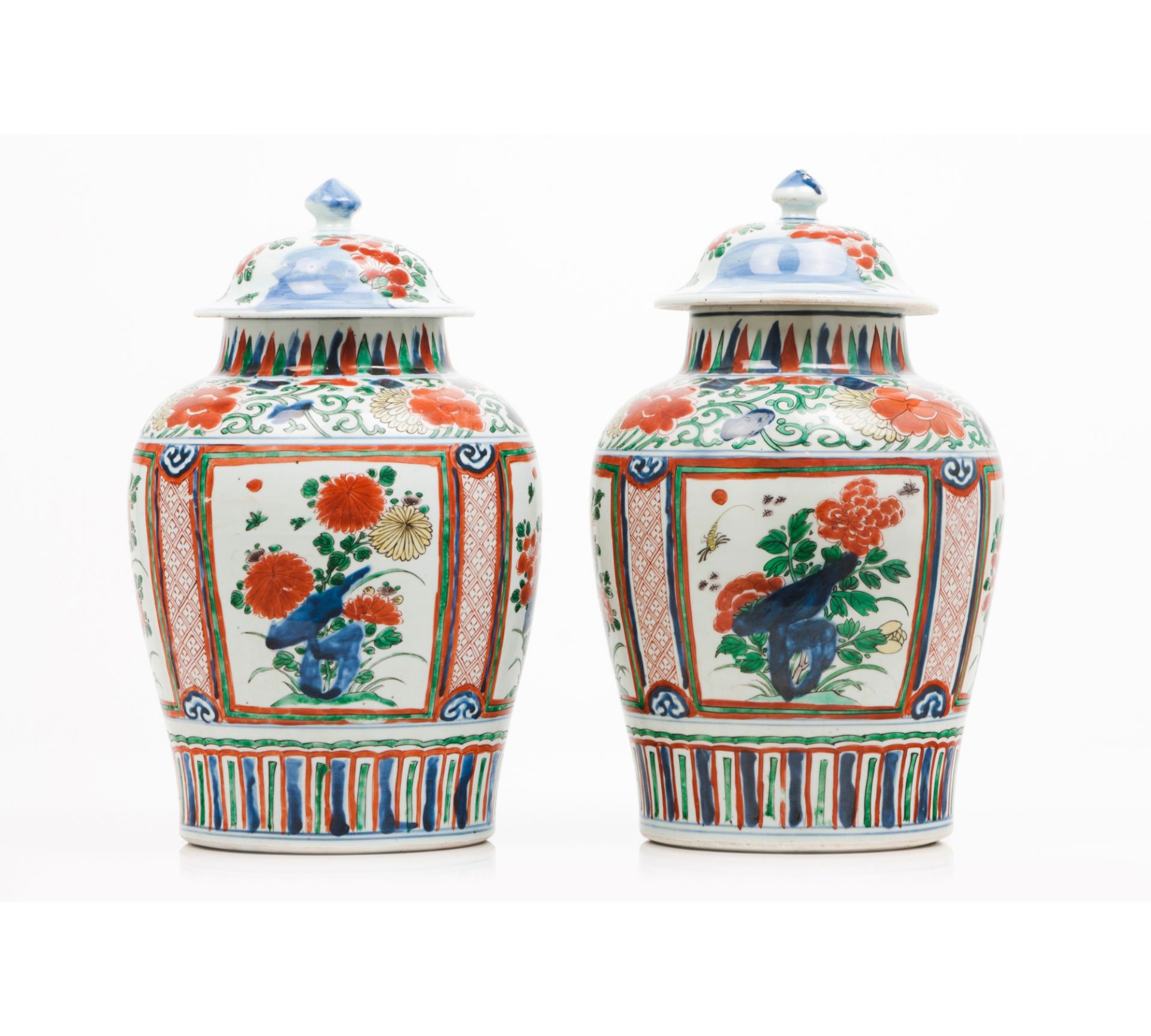 A pair of pots with covers